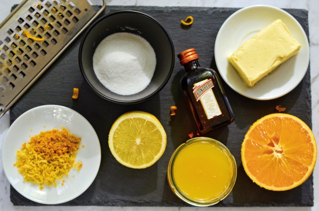 Ingredients for vegan crepe suzette orange sauce: orange juice, sugar, orange and lemon zest, orange liqueur, vegan butter, orange and lemon and zester