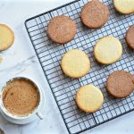 vegan tea biscuits on cooling rack with acoffee on side