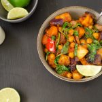 Harissa Roasted root vegetables with chickpeas and spinach served with tahini sauce