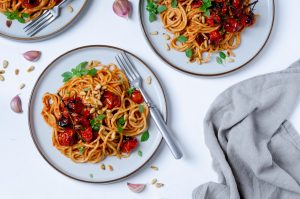 red pesto pasta with roasted tomato